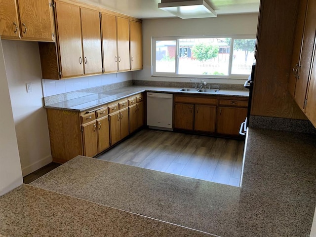 1878 Wolviston Way, San Diego, CA 92154 - kitchen featuring white dishwasher, light wood-type flooring, brown cabinets, and light countertops