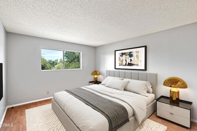 5870 Benner St Unit 102, Los Angeles, CA 90042 - bedroom with wood finished floors and a textured ceiling