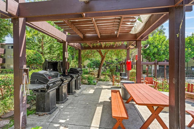5870 Benner St Unit 102, Los Angeles, CA 90042 - view of patio with area for grilling, a pergola, and outdoor dining space