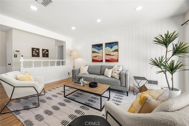 17139 Strathern St, Van Nuys, CA 91406 - living area with wood finished floors, recessed lighting, and a decorative wall