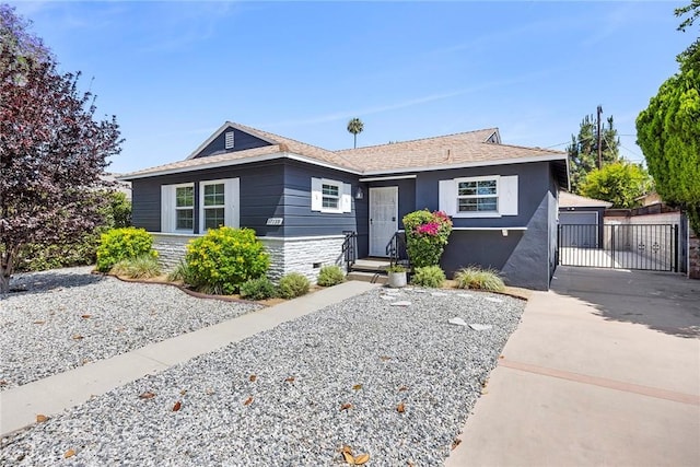 17139 Strathern St, Van Nuys, CA 91406 - view of front of home featuring an outbuilding, stone siding, and a garage