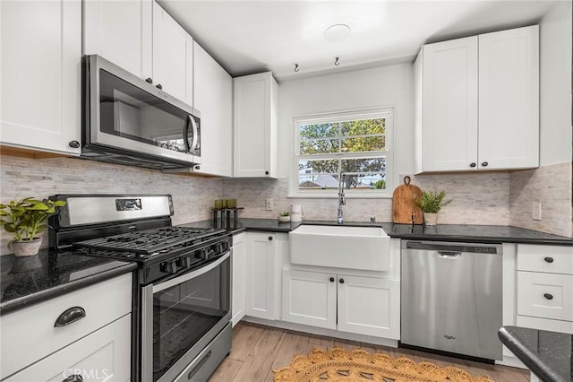 17139 Strathern St, Van Nuys, CA 91406 - kitchen with stainless steel appliances, white cabinets, and light wood-type flooring