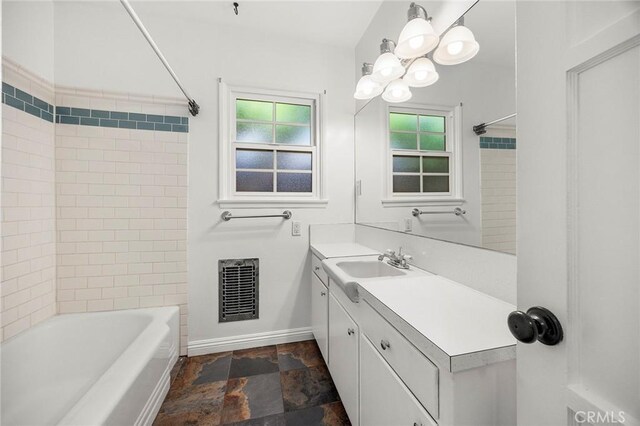 17139 Strathern St, Van Nuys, CA 91406 - full bath with vanity,  shower combination, stone finish floors, and a chandelier