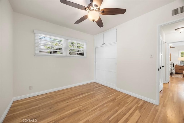 17139 Strathern St, Van Nuys, CA 91406 - unfurnished bedroom featuring light wood-type flooring, multiple windows, a closet, and a ceiling fan