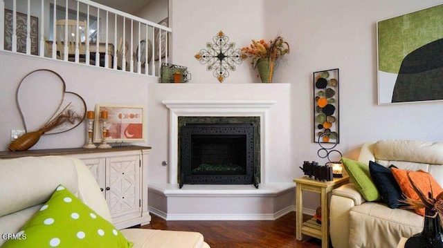 1239 Bayside Ln, Oxnard, CA 93035 - living room featuring wood finished floors and a fireplace with raised hearth