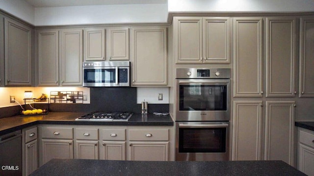 1239 Bayside Ln, Oxnard, CA 93035 - kitchen featuring appliances with stainless steel finishes, dark countertops, and gray cabinets