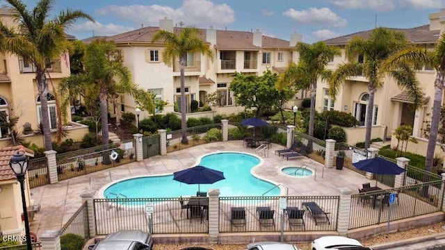 1239 Bayside Ln, Oxnard, CA 93035 - community pool featuring a hot tub, a patio, and a residential view