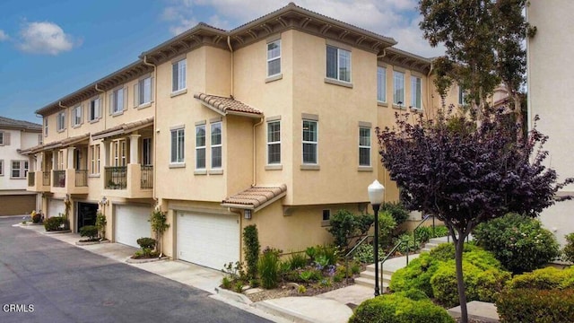 1239 Bayside Ln, Oxnard, CA 93035 - view of building exterior with a garage