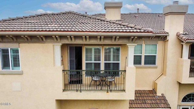 1239 Bayside Ln, Oxnard, CA 93035 - exterior space with a tile roof, stucco siding, and a chimney
