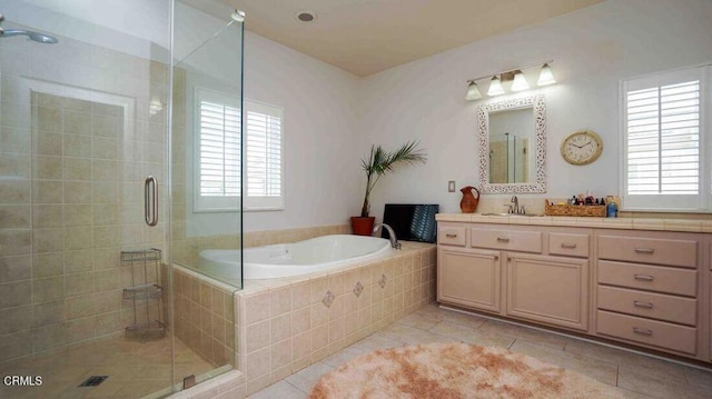 1239 Bayside Ln, Oxnard, CA 93035 - full bath featuring tile patterned flooring, plenty of natural light, vanity, and a garden tub