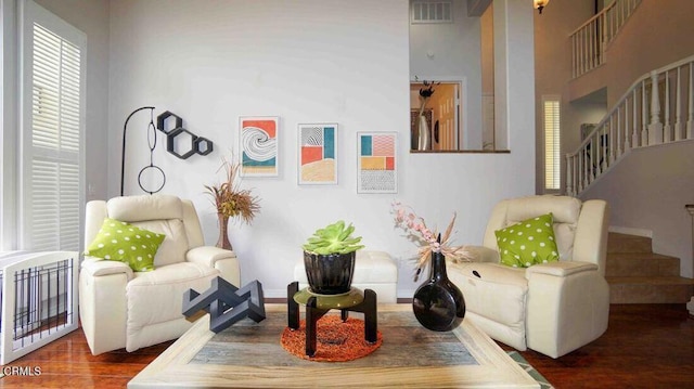 1239 Bayside Ln, Oxnard, CA 93035 - living area featuring wood finished floors, stairs, and a towering ceiling