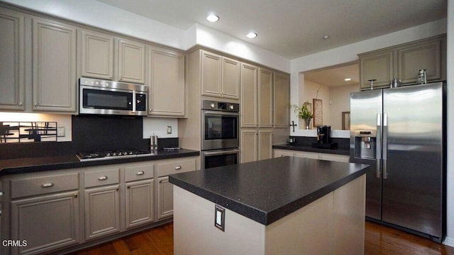1239 Bayside Ln, Oxnard, CA 93035 - kitchen with stainless steel appliances, dark wood finished floors, recessed lighting, and dark countertops
