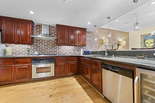 301 W G St Unit 119, San Diego, CA 92101 - kitchen with appliances with stainless steel finishes, beverage cooler, wall chimney range hood, light wood-type flooring, and reddish brown cabinets