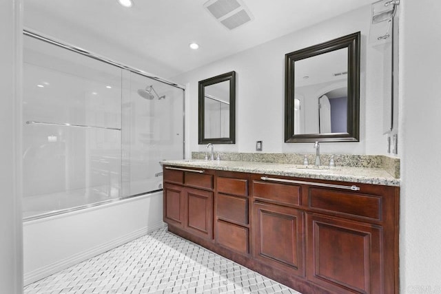 301 W G St Unit 119, San Diego, CA 92101 - bathroom with double vanity, enclosed tub / shower combo, and recessed lighting