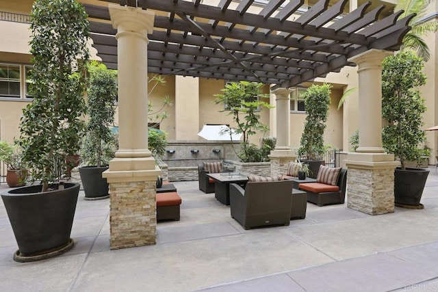301 W G St Unit 119, San Diego, CA 92101 - view of patio featuring an outdoor living space and a pergola