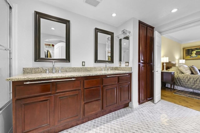 301 W G St Unit 119, San Diego, CA 92101 - bathroom featuring double vanity, recessed lighting, and ornamental molding