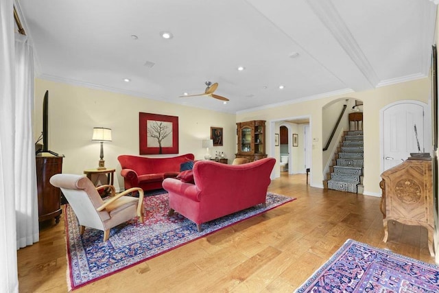 301 W G St Unit 119, San Diego, CA 92101 - living area featuring arched walkways, ornamental molding, wood finished floors, stairs, and recessed lighting