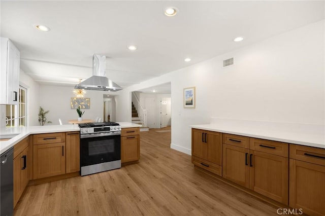 1345 W Valley View Dr, Fullerton, CA 92833 - kitchen featuring range hood, gas stove, a peninsula, light wood finished floors, and light countertops