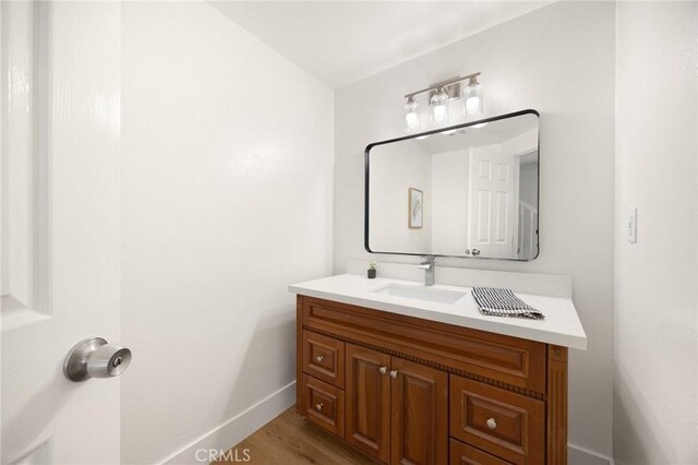 1345 W Valley View Dr, Fullerton, CA 92833 - bathroom with vanity and wood finished floors