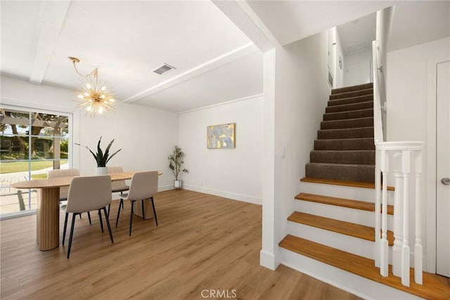 1345 W Valley View Dr, Fullerton, CA 92833 - dining space featuring stairs, light wood-style floors, and a chandelier