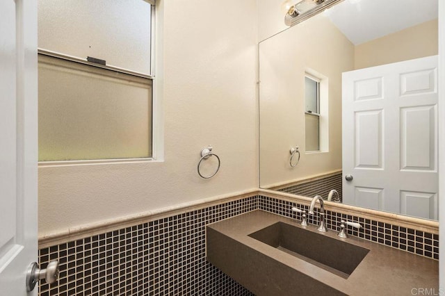 15140 Chase St, North Hills, CA 91343 - bathroom with wainscoting, vanity, and tile walls