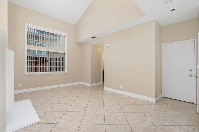 15140 Chase St, North Hills, CA 91343 - spare room featuring light tile patterned floors and lofted ceiling