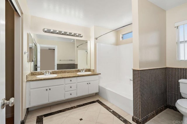 15140 Chase St, North Hills, CA 91343 - bathroom featuring plenty of natural light, shower / bath combination, double vanity, and tile patterned floors