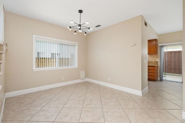 15140 Chase St, North Hills, CA 91343 - empty room with a chandelier and light tile patterned floors