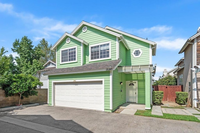 15140 Chase St, North Hills, CA 91343 - view of front of property featuring a garage and asphalt driveway