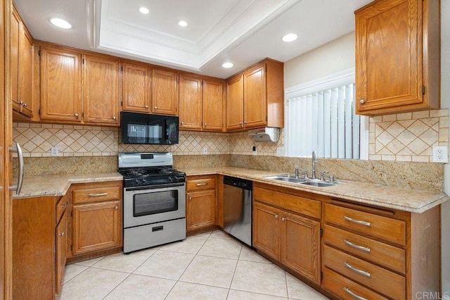 15140 Chase St, North Hills, CA 91343 - kitchen featuring appliances with stainless steel finishes, brown cabinetry, light tile patterned flooring, a raised ceiling, and backsplash