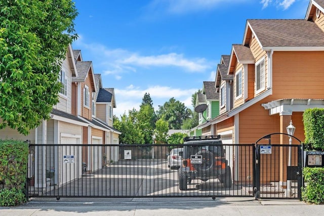 15140 Chase St, North Hills, CA 91343 - view of street with a gated entry, a gate, and street lights