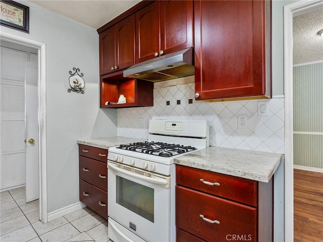 2724 Scott Rd, Burbank, CA 91504 - kitchen featuring gas range gas stove, under cabinet range hood, and reddish brown cabinets