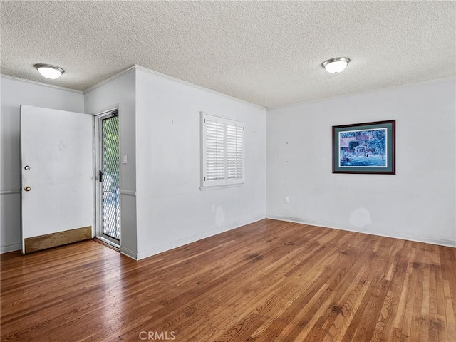 2724 Scott Rd, Burbank, CA 91504 - spare room with a textured ceiling, wood finished floors, and ornamental molding