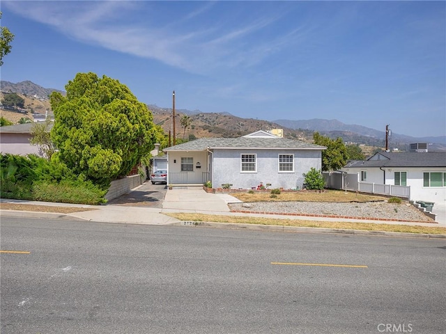 2724 Scott Rd, Burbank, CA 91504 - view of front of house with a mountain view, stucco siding, and driveway