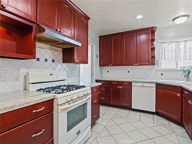 2724 Scott Rd, Burbank, CA 91504 - kitchen with white appliances, under cabinet range hood, dark brown cabinets, and recessed lighting