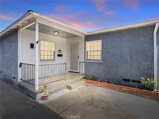 2724 Scott Rd, Burbank, CA 91504 - exterior entry at dusk with crawl space and stucco siding
