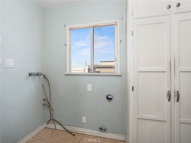 2724 Scott Rd, Burbank, CA 91504 - laundry room with baseboards and light tile patterned floors