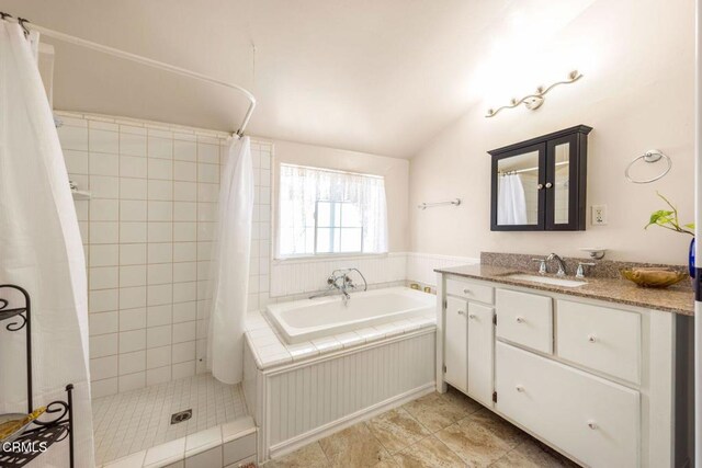 216 N Fulton St, Ojai, CA 93023 - full bath with vanity, a bath, a tile shower, vaulted ceiling, and tile patterned flooring