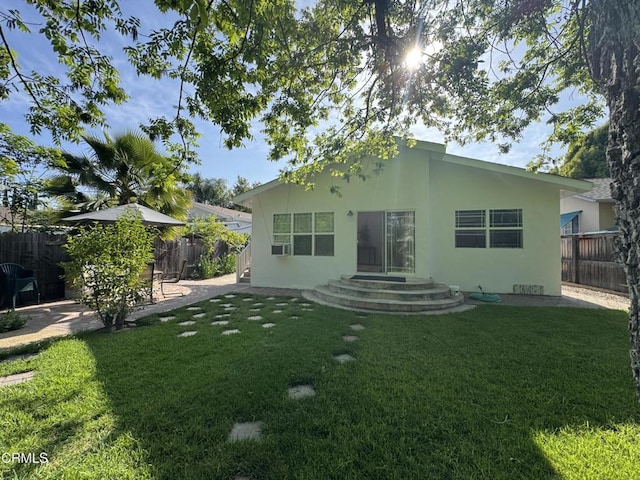 216 N Fulton St, Ojai, CA 93023 - rear view of house with a fenced backyard, stucco siding, a patio, and cooling unit
