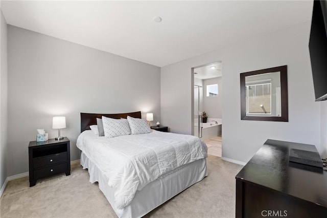 16502 Casa Grande Ave Unit 318, Fontana, CA 92336 - bedroom featuring light colored carpet and ensuite bathroom