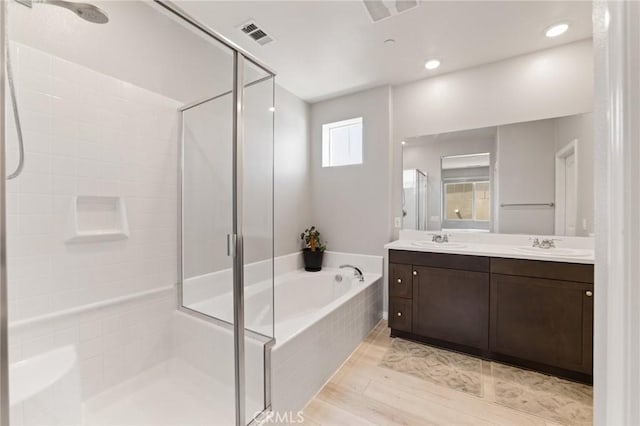 16502 Casa Grande Ave Unit 318, Fontana, CA 92336 - bathroom with a stall shower, double vanity, and a bath
