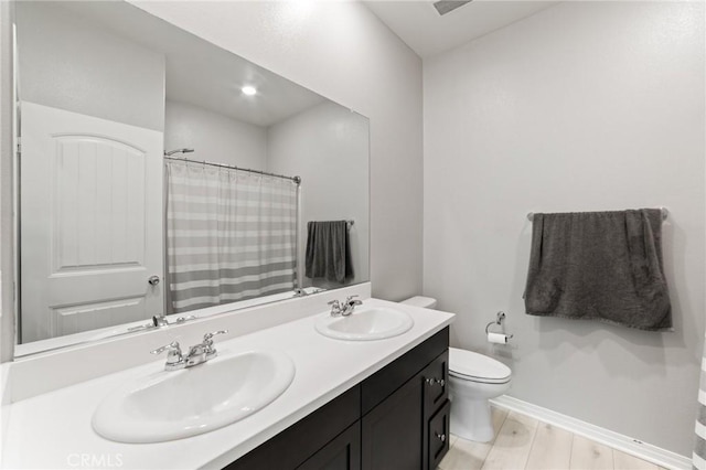 16502 Casa Grande Ave Unit 318, Fontana, CA 92336 - bathroom with double vanity, wood finished floors, and curtained shower