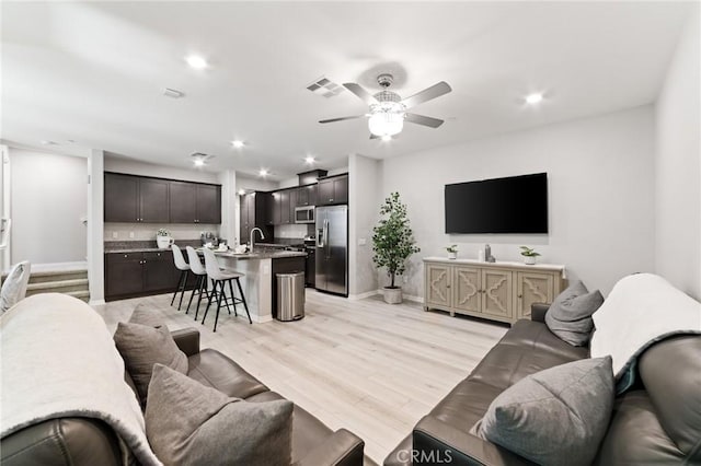 16502 Casa Grande Ave Unit 318, Fontana, CA 92336 - living room featuring a ceiling fan, recessed lighting, and light wood-style flooring