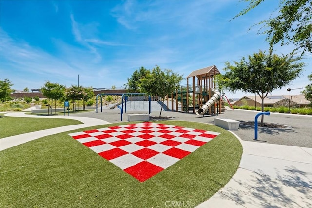 16502 Casa Grande Ave Unit 318, Fontana, CA 92336 - view of community with a playground and a lawn