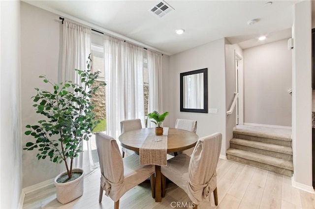 16502 Casa Grande Ave Unit 318, Fontana, CA 92336 - dining space featuring stairs, light wood-style flooring, and recessed lighting
