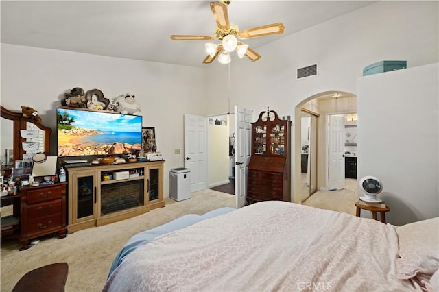 5647 Redwood Ave, Palmdale, CA 93551 - carpeted bedroom featuring arched walkways, high vaulted ceiling, and ceiling fan