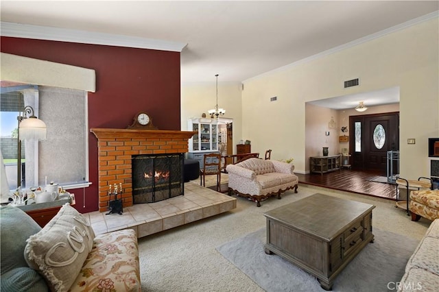 5647 Redwood Ave, Palmdale, CA 93551 - living area with ornamental molding, a brick fireplace, a chandelier, and carpet