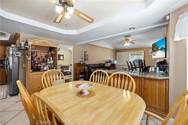 5647 Redwood Ave, Palmdale, CA 93551 - dining area featuring ceiling fan, light tile patterned floors, a tray ceiling, and vaulted ceiling