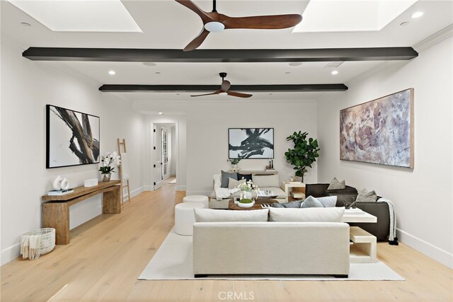 6 Rickie, Ladera Ranch, CA 92694 - living area featuring a ceiling fan, beamed ceiling, light wood-type flooring, a skylight, and recessed lighting