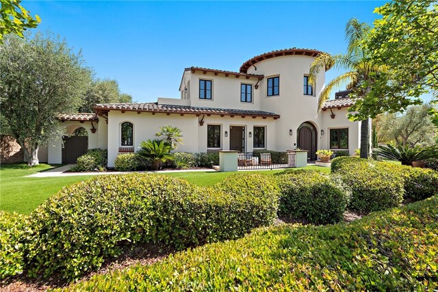 6 Rickie, Ladera Ranch, CA 92694 - back of property featuring a tiled roof, stucco siding, and a lawn